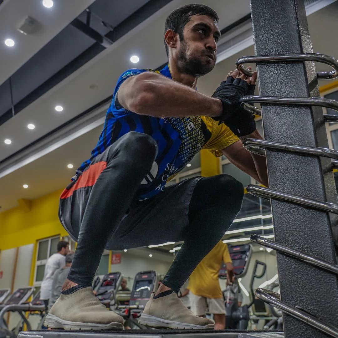 Young athlete performing jumping squats during a conditioning session