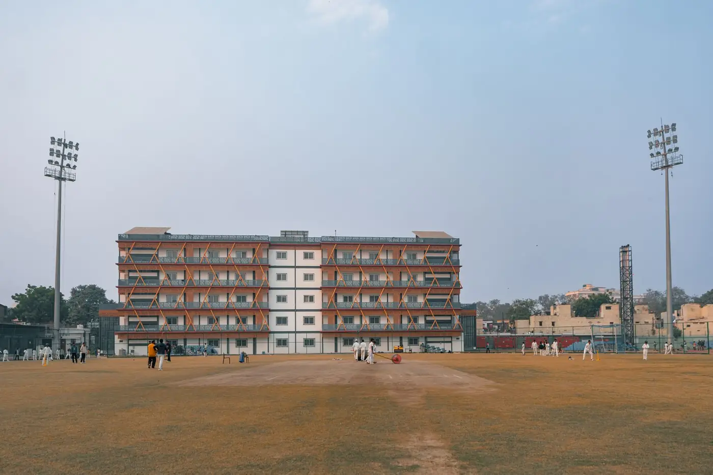 Cricket ground viewed from pitch level, available for net and ground booking