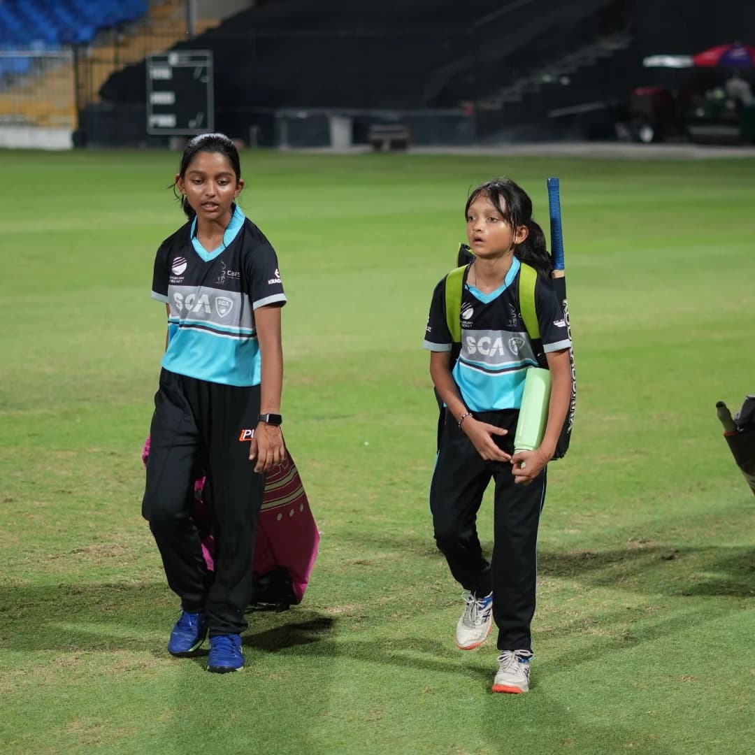 Girls taking part in a cricket coaching session